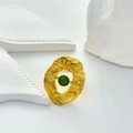 Detailed close-up of a gold geometric ring with a green gemstone on white art props - Adjustable Open / Gold
