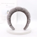Detail of gray velvet braided headband on white tray with natural texture and high sheen - Gray