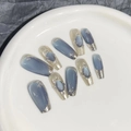 Detailed view of long trapezoid blue-grey cat-eye press-on nails with golden metal edges - Extra Small (XS) / Blue/Long Coffin