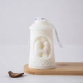 Pillar scented candle in cream white featuring romantic 3D couple relief and ribbon - Touch (White)
