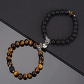 Detail view of heart-shaped magnetic clasp on tiger eye and matte black stone bracelets - Tiger Eye & Frosted Black With White Heart Magnet