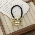 Punk style golden hollowed metal hair ring with black elastic band on vintage paper - GD430 Gold Rounded Hollow