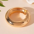 Macro shot of gold polished wide band geometric hinge bracelet with glossy metallic finish - Chunky Hinge Clasp Style / Shiny Gold (HB3410)
