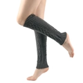 Detailed close-up of dark grey cable knit leg warmers with ribbed cuffs on model legs - One Size / Dark Gray