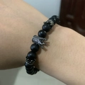 Luxurious black onyx bead bracelet with silver crown charms worn on a male wrist - Silver Crown Black Agate Style