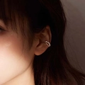Close-up of double-layer silver metal ear cuff with small beads on a model's ear - Gold Double-Layer Beaded Ear Bone Clip