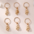 Set of six golden conch shell hair charms for children with circular metal rings - Conch / Gold