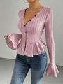Close-up of pink-purple knit cardigan with black buttons and ruffled hem details - S / Pink