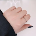 Sleek silver titanium steel ring featuring micro-set cubic zirconia on a slim band - US 6 / Three Zirconia / Steel