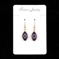 Faceted marquise dark blue glitter stone earrings in gold finish on jewelry card - Blue Sandstone