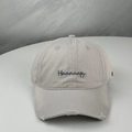 Close-up of embroidered Haaaaapy text and distressed ripped brim on gray baseball cap - One Size (58-60cm) / Gray
