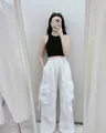 Women's vintage white high waist cargo pants with pockets and black halter crop top - S / White