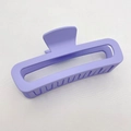 Macro detail of purple matte square claw clip with hollow design on grey fabric - Large (13CM) / Violet
