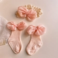 Detail view of infant pink bow socks and lace headband set for baby girl photo props - (Pink) Silk Finish Bow Set