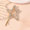 Sparkling star hair clip with crystals and golden finish on a soft pink background - Medium / Gold