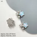 Macro detail of star-shaped jewelry charms with aurora blue center and faux pearl - Blue Star