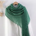 Solid dark green pleated cotton linen scarf with frayed edges hanging on a white shirt - Army Green