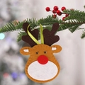 Cute non-woven Christmas reindeer ornament with green ribbon hanging on a tree branch - Big Face Elk