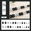 Detail view of square cow print and glossy black press-on nails set in 24 pieces - R692 Cow Print