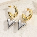 Minimalist C-shaped gold hoop earrings with silver heart pendant on textured background - Silver Solid Heart
