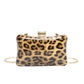 Detailed shot of leopard print acrylic evening clutch with gold metal clasp and chain - Brown
