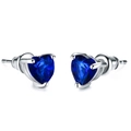 Macro shot of silver stud earrings featuring heart-shaped blue zircon in a three-prong setting - Blue Zirconia