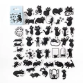 Detailed macro view of assorted cute black and white cat stickers for DIY journals - Mr. Edgar