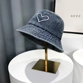 Detail of white heart embroidery and parallel stitching on washed blue denim bucket hat - Blue / One Size(58cm)