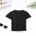 Classic black crewneck t-shirt laid flat with casual lifestyle props and palm leaf - XS / Black