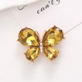 Macro shot of gold butterfly charm with yellow pear-cut rhinestones on minimalist card - D1995 Crystal Gem Butterfly (Golden)