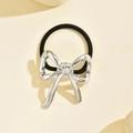 Close-up of high-elasticity hair tie with liquid metal silver bow decoration - Bowknot Silver