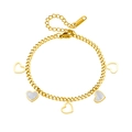 Bracelet gourmette en acier doré avec incrustations de nacre et breloques en forme de cœur - Bracelet Coeur Évidé en Coquille Blanche (N205)