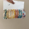 Close-up of 7 pairs of acetate leopard print C-shape hoop earrings on a display card - Gold Multi-color (Multi Pair Set)