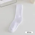 Minimalist white ribbed mid-calf socks in pure cotton for a Korean style campus look - White
