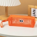 Detail of orange mesh pencil case with big eyes patch and sturdy portable handle strap - Orange