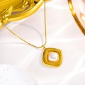 Detailed close-up of a 18K gold stainless steel square pendant with white shell inlay - Gold Square + White Pearl