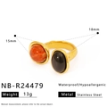 Detail of vintage gold open ring with dual natural orange and black stones on white background - Double Spotted Orange-Red and Black Stone Style (NB-R24479)