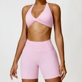 Pink two-piece yoga set featuring a halter twist sports bra and high-waist biker shorts - S / Top And Bottom / Sakura Pink