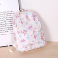 White casual backpack with colorful star patterns and a front zipper pocket - Star
