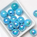 Macro view of blue iridescent acrylic beads for DIY jewelry making in a white ceramic dish - Dark Blue