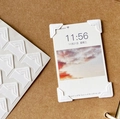 White embossed photo corners for DIY scrapbooking shown on kraft background - Pure White
