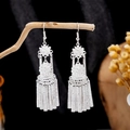 Ethnic style long tassel earrings in bright silver finish with floral metal design - Retro Flower Tubular Tassel Bright Silver Style (E2871- 4)