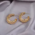 Elegant gold hollow grid C-shaped hoop earrings on a luxury silk background - Hollow Mesh C-Shape / E-085---Gold