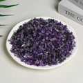 Polished natural purple amethyst crystal chips displayed in a round white ceramic plate - 100 Grams Of High-quality Amethyst (5-7mm)