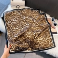 Detail of leopard print silk scarf with black and white striped border on plush background - 70*70cm / Leopard Print Black & White Border