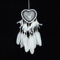 Elegant white lace heart dream catcher with soft feathers and beige beads on black background - Heart Without Lights / White