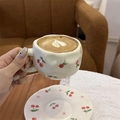 Hand-painted ceramic coffee cup with cherry pattern and heart latte art detail - Cute Cherry