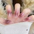 Cat eye press-on nails with pink purple gradient and glitter in oval shape on soft background - Ellipse In By2031 / Phototherapy Glue Style