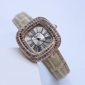Close-up of square rose gold watch with beige leather strap and rhinestone bezel - Light Yellow Rose Gold Case