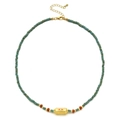 Detail of turquoise beaded necklace with gold Evil Eye pendant and adjustable chain - Greenish Beads - Orange-Red Eye